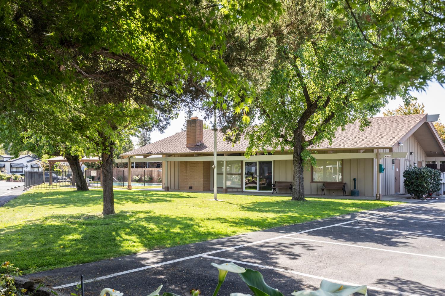 8701 Highway 41, Unit 52 Fresno, CA 93720 - Photo 35 of 66 a view of a house with a big yard and large trees