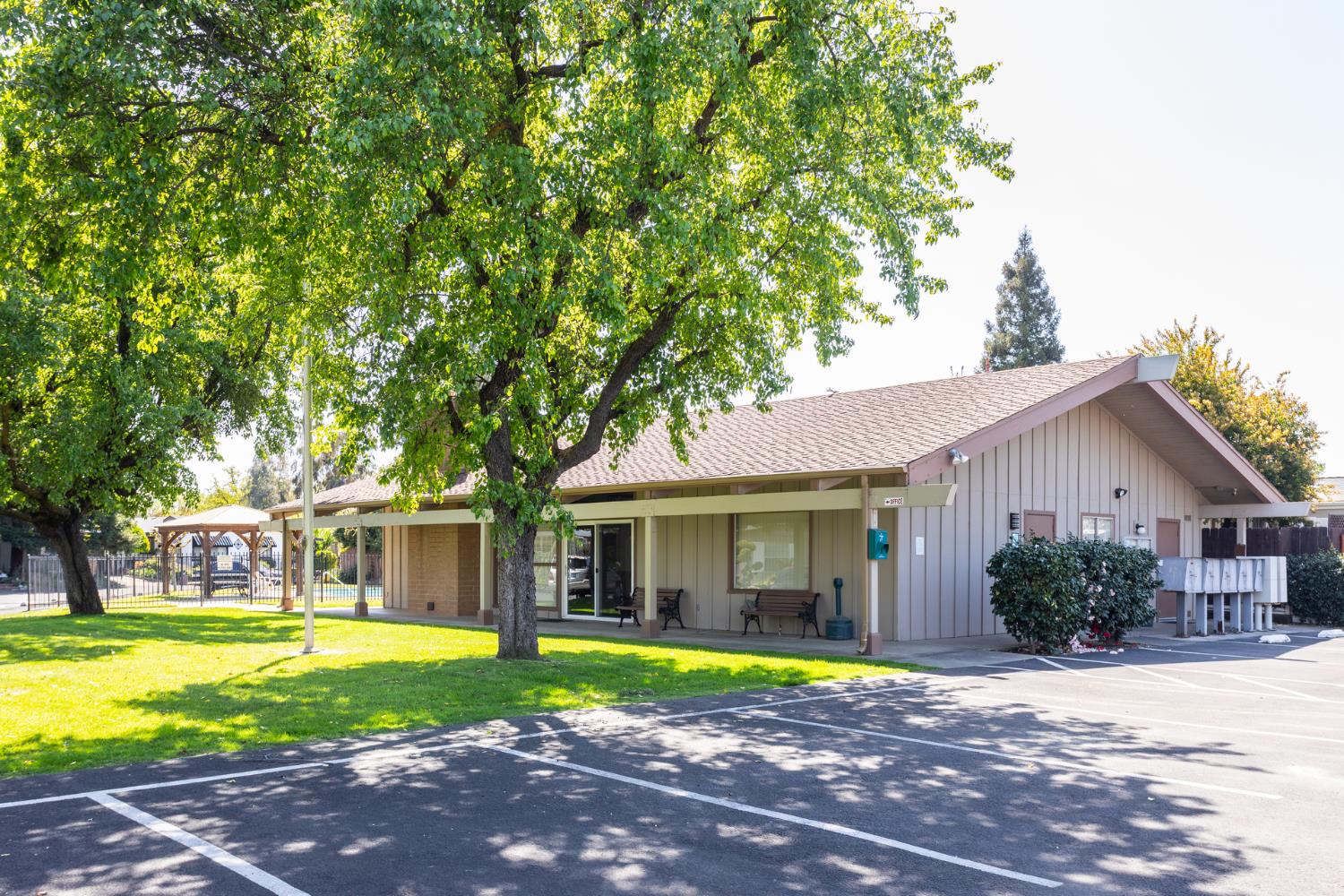 8701 Highway 41, Unit 52 Fresno, CA 93720 - Photo 36 of 66 a view of a house with a yard and large tree