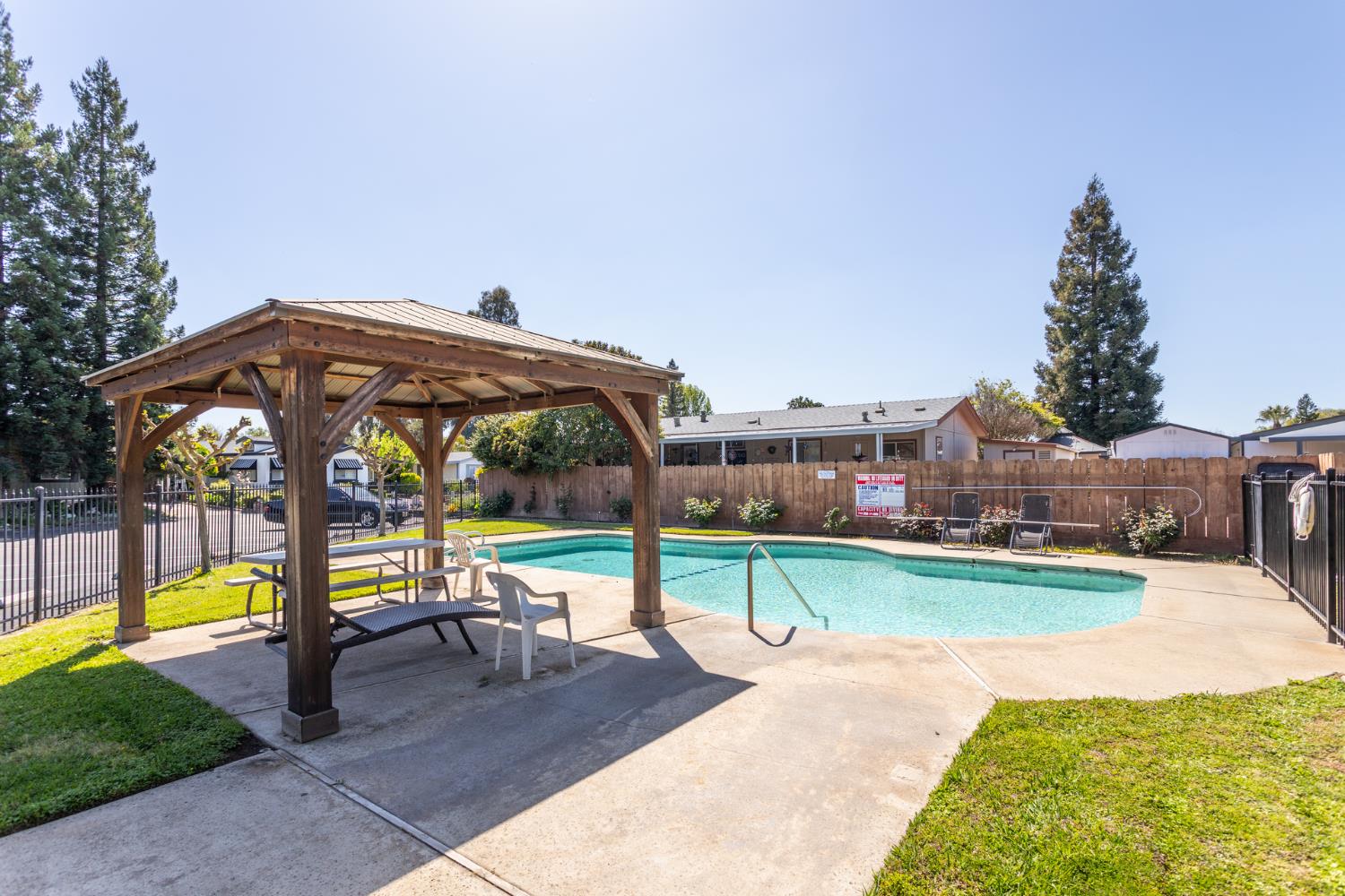 8701 Highway 41, Unit 52 Fresno, CA 93720 - Photo 40 of 66 a view of a swimming pool with a patio