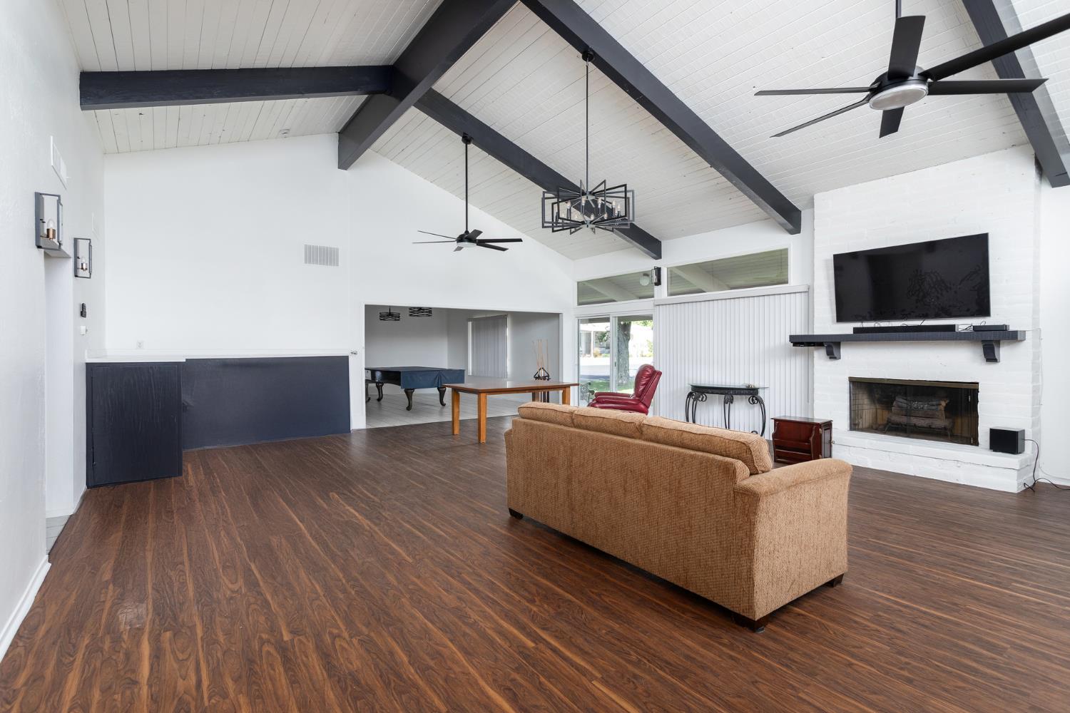 8701 Highway 41, Unit 52 Fresno, CA 93720 - Photo 45 of 66 a living room with furniture and a flat screen tv