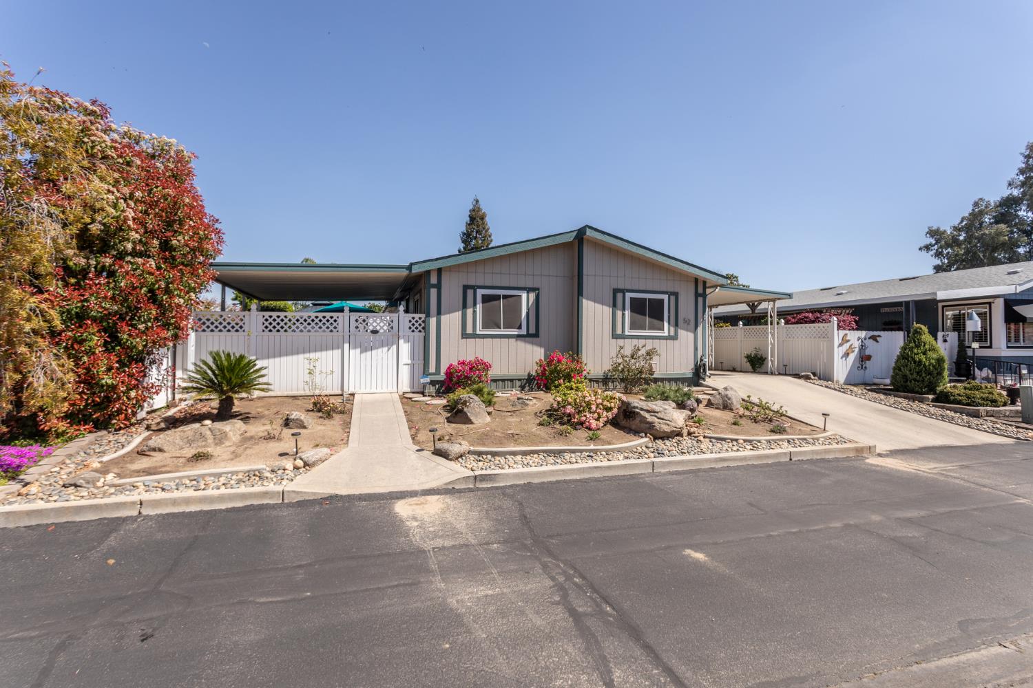 8701 Highway 41, Unit 52 Fresno, CA 93720 - Photo 48 of 66 a view of a house with a yard and sitting area