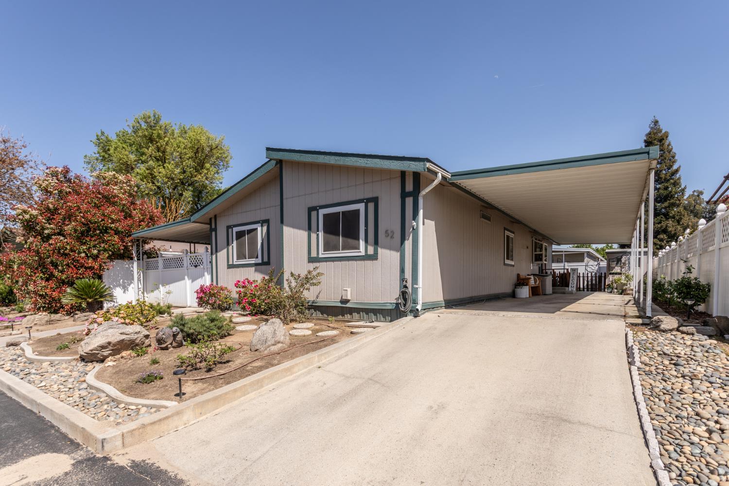 8701 Highway 41, Unit 52 Fresno, CA 93720 - Photo 51 of 66 a front view of a house with a yard