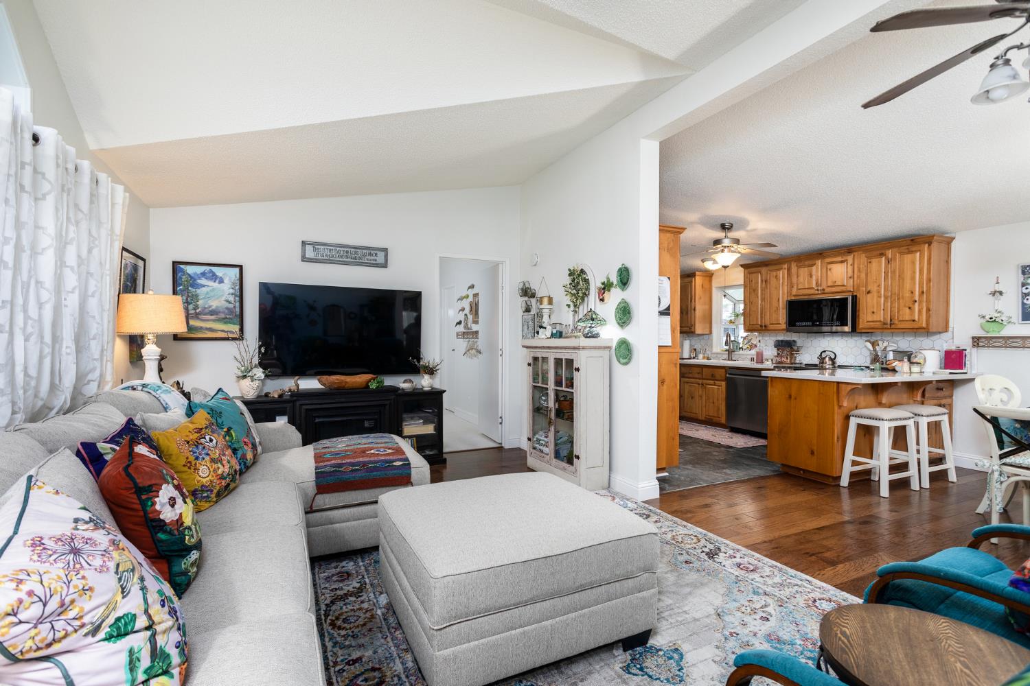 8701 Highway 41, Unit 52 Fresno, CA 93720 - Photo 52 of 66 a living room with furniture and a flat screen tv