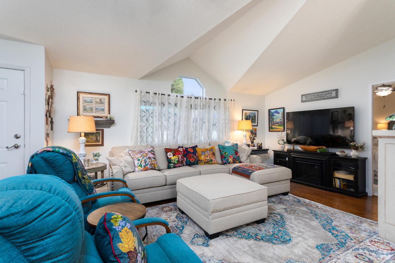 8701 Highway 41, Unit 52 Fresno, CA 93720 - Photo 53 of 66 a living room with furniture and a flat screen tv