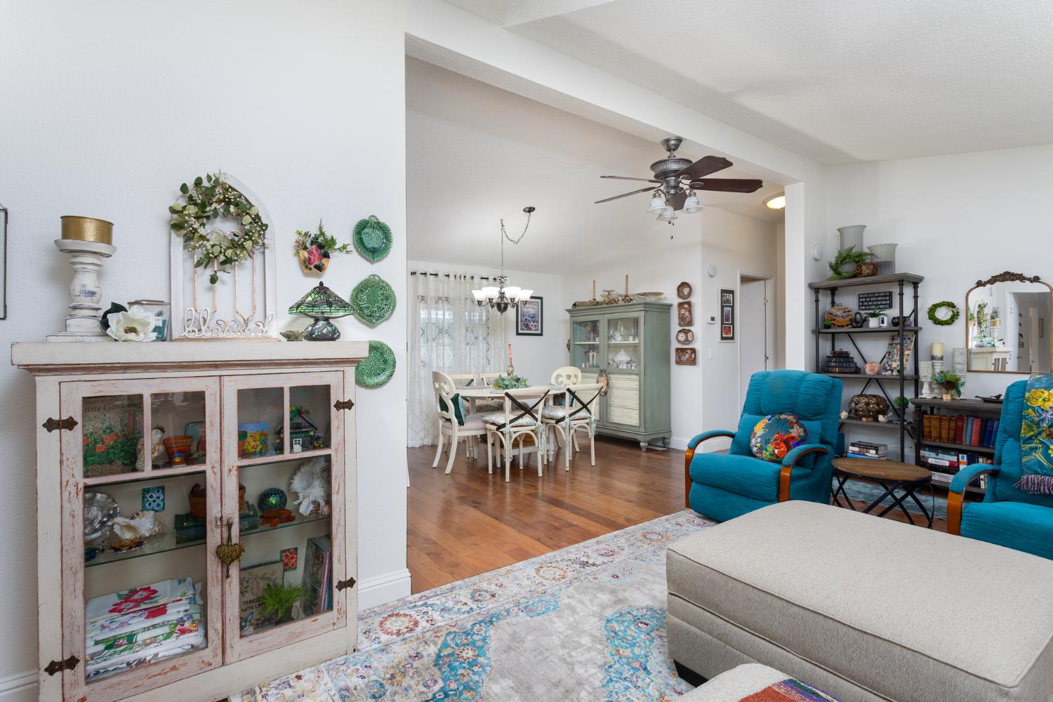 8701 Highway 41, Unit 52 Fresno, CA 93720 - Photo 56 of 66 a living room with furniture and a floor to ceiling window