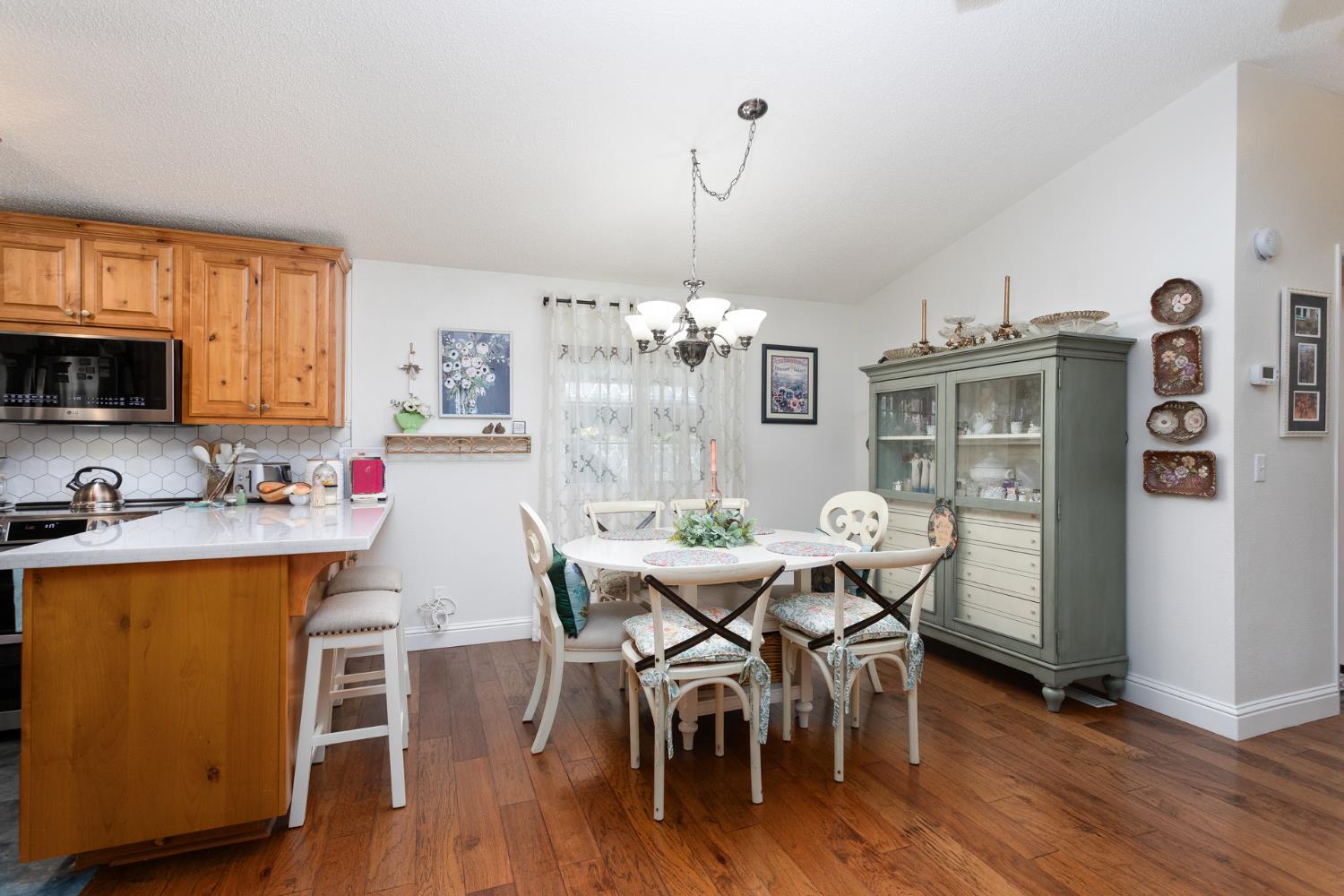8701 Highway 41, Unit 52 Fresno, CA 93720 - Photo 57 of 66 a view of a dining room with furniture window and wooden floor