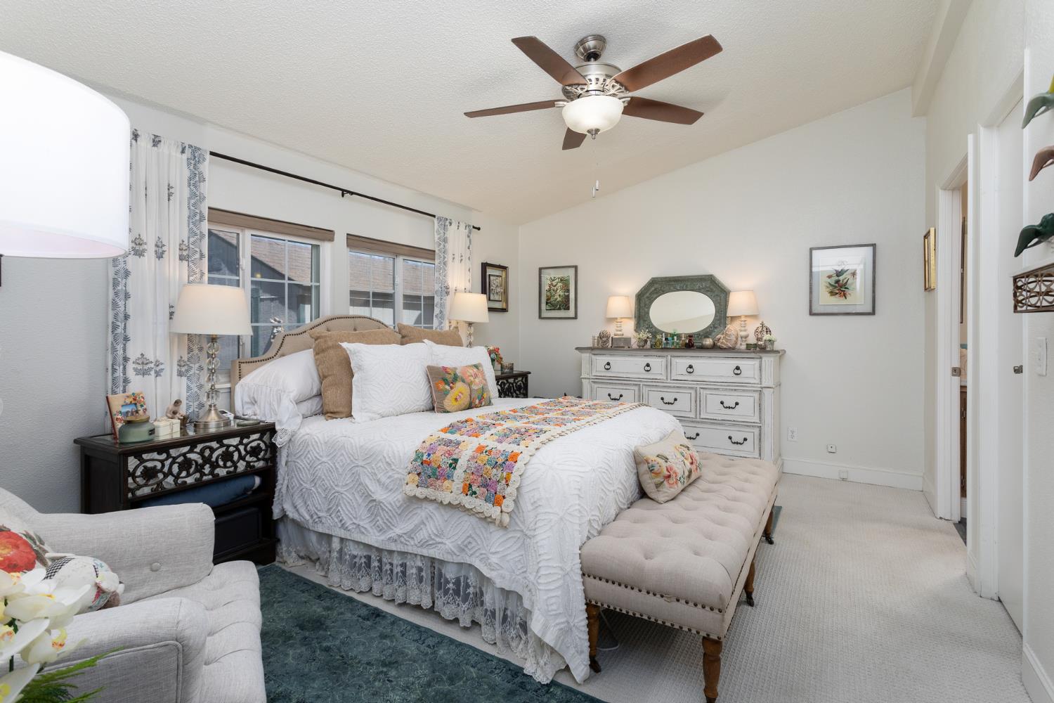 8701 Highway 41, Unit 52 Fresno, CA 93720 - Photo 65 of 66 a bedroom with bed and a chandelier