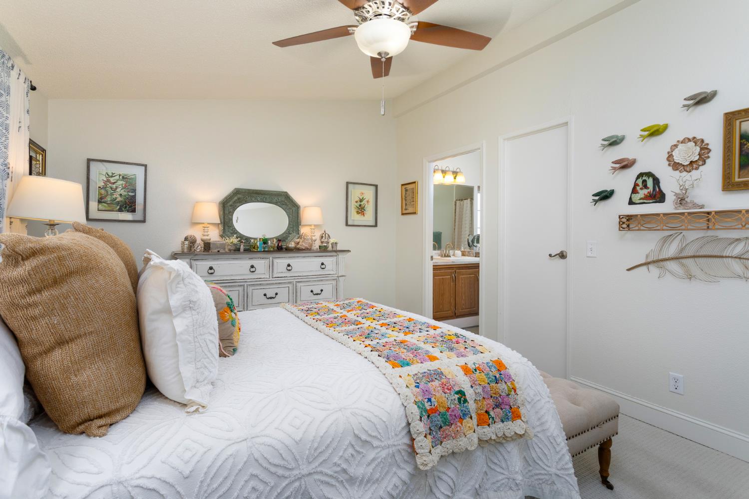 8701 Highway 41, Unit 52 Fresno, CA 93720 - Photo 66 of 66 a bedroom with a bed and dresser with mirror