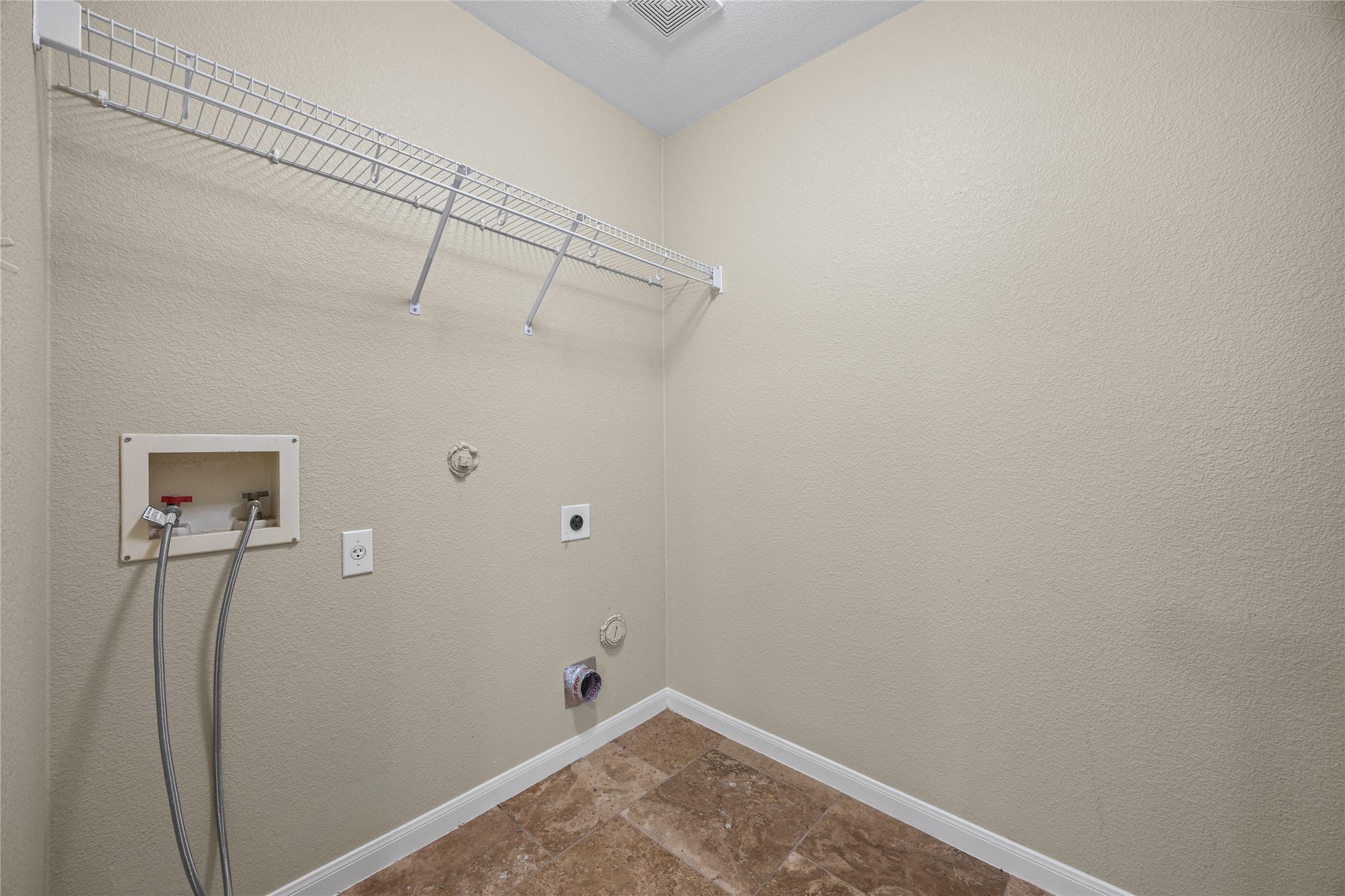 198 Black Forest Road Buda, TX 78610 - Photo 8 of 23 Functional utility room with convenient overhead shelving.