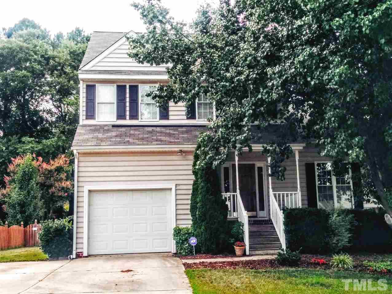 9416 Dawnshire Road Raleigh, NC 27615 - Photo 1 of 17 a front view of a house with garage