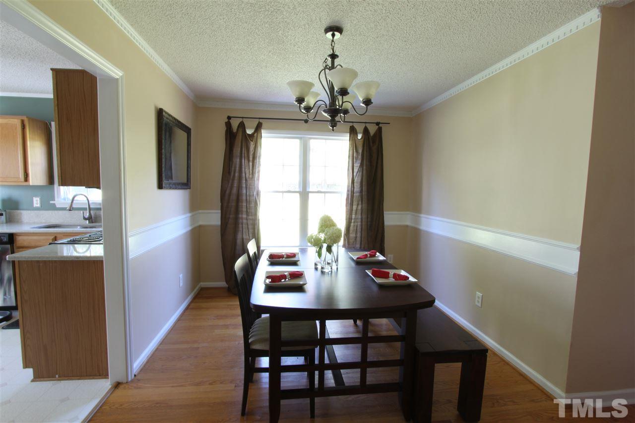 9416 Dawnshire Road Raleigh, NC 27615 - Photo 6 of 17 a view of a dining room with furniture window and outside view