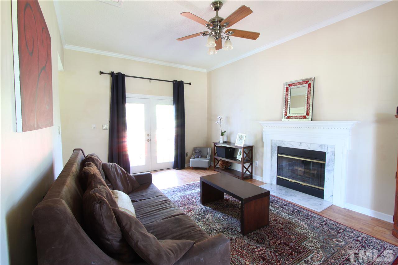 9416 Dawnshire Road Raleigh, NC 27615 - Photo 8 of 17 a living room with furniture fireplace and window