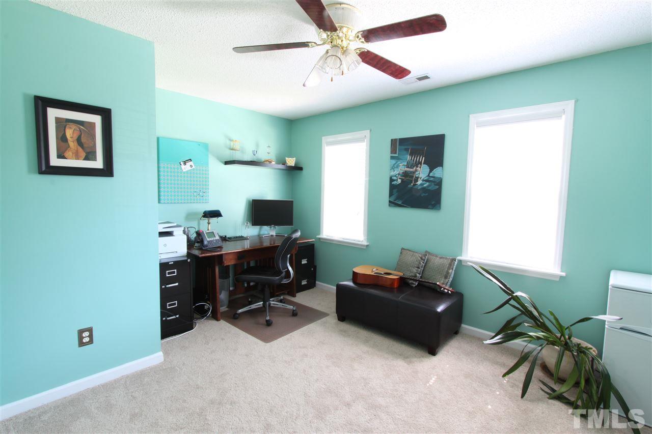 9416 Dawnshire Road Raleigh, NC 27615 - Photo 9 of 17 a livingroom with workspace and a window