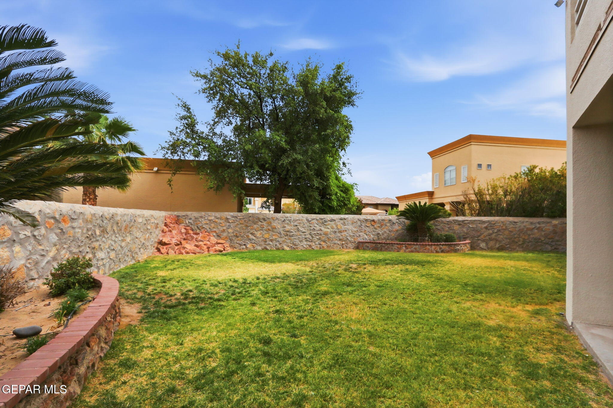 5806 Diamond Point Circle El Paso, TX 79912 - Photo 55 of 61 a front view of a house with a yard