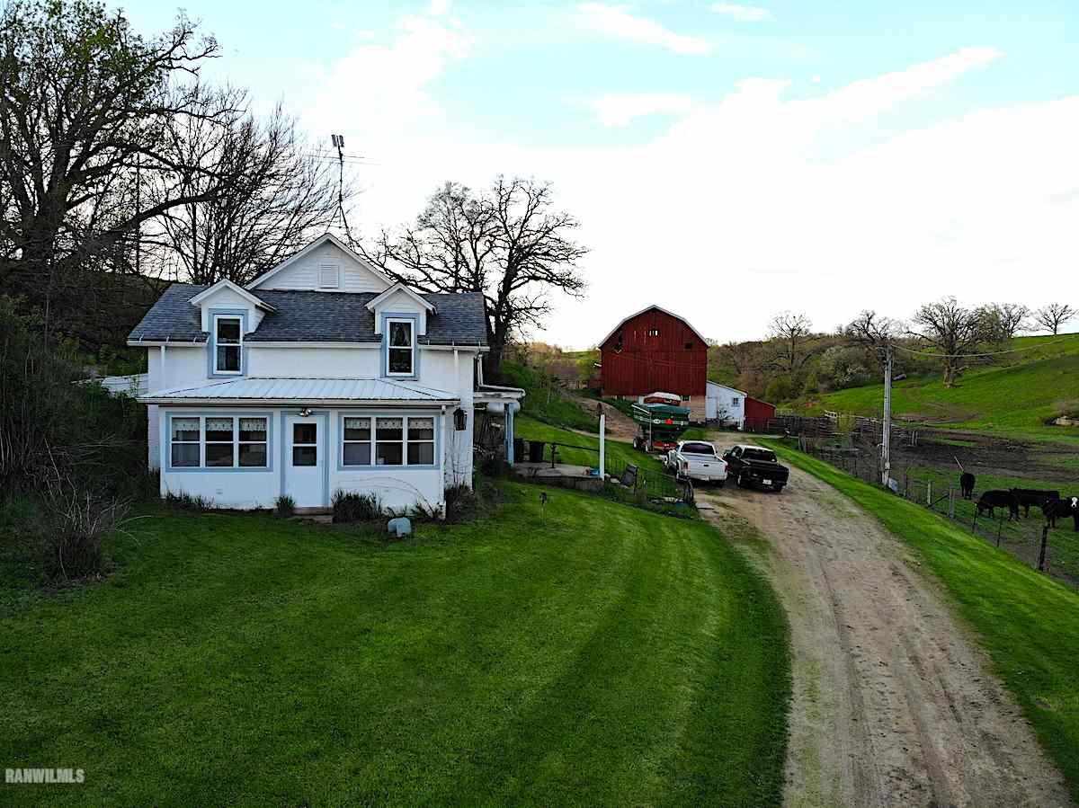 2630 West Longhollow Road Elizabeth, IL 61028 - Photo 1 of 10 a view of a house with a yard and sitting area