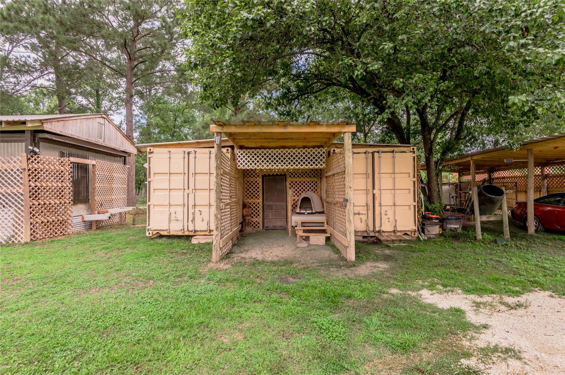 159 Pecan Avenue Groveton, TX 75845 - Photo 17 of 27 a view of a house with backyard and a tree