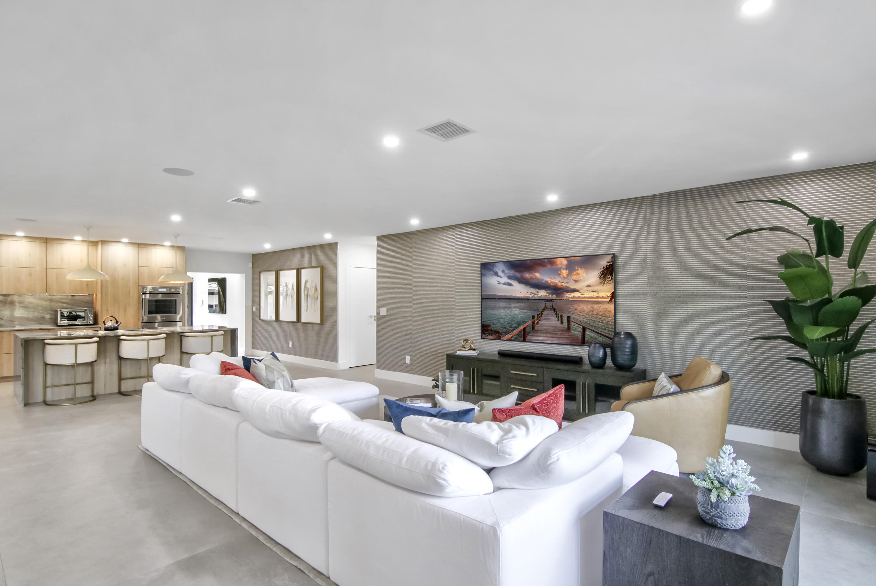 13244 Polo Club Road, Unit C105 Wellington, FL 33414 - Photo 12 of 42 a living room with furniture and a flat screen tv