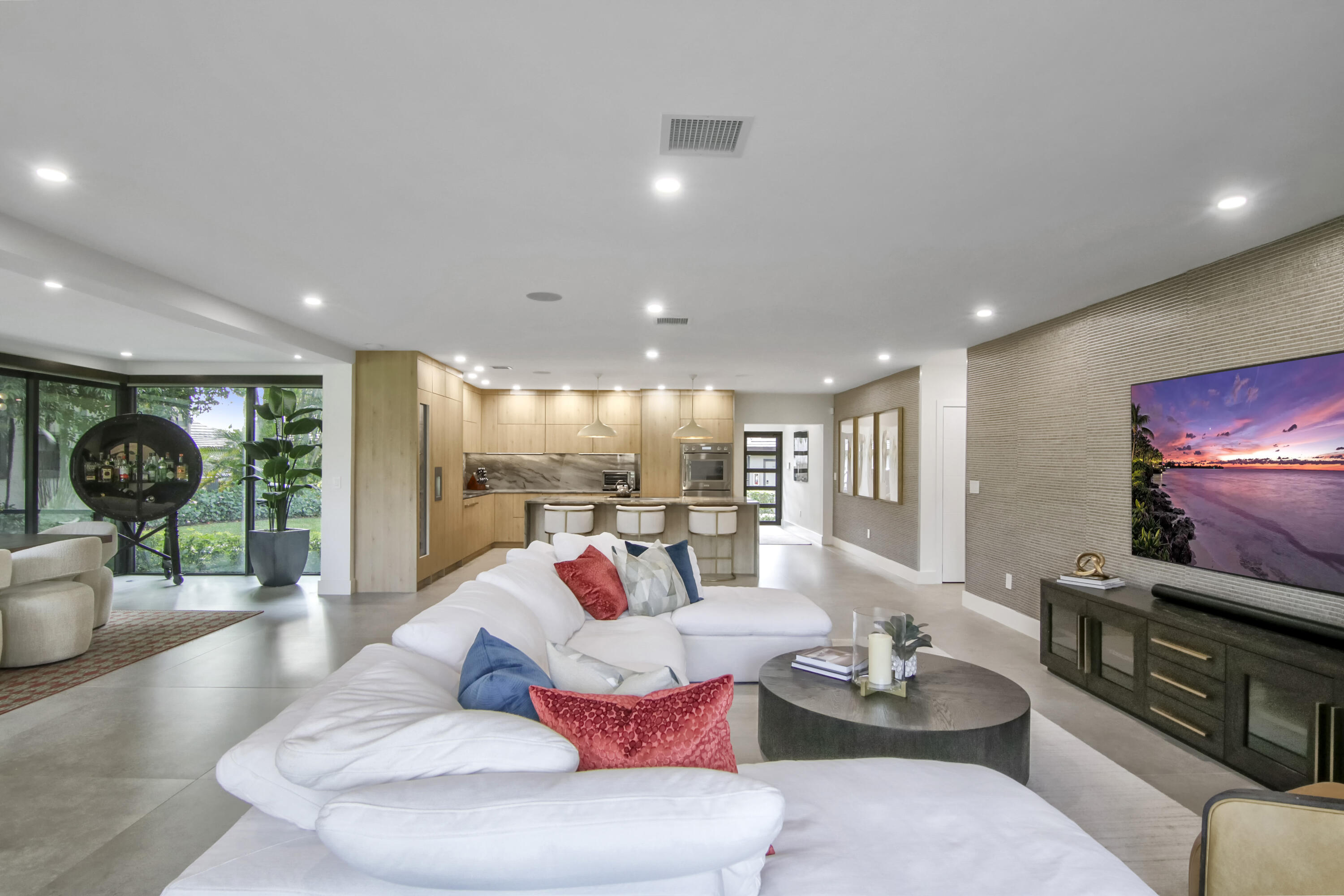 13244 Polo Club Road, Unit C105 Wellington, FL 33414 - Photo 13 of 42 a living room with furniture and a flat screen tv