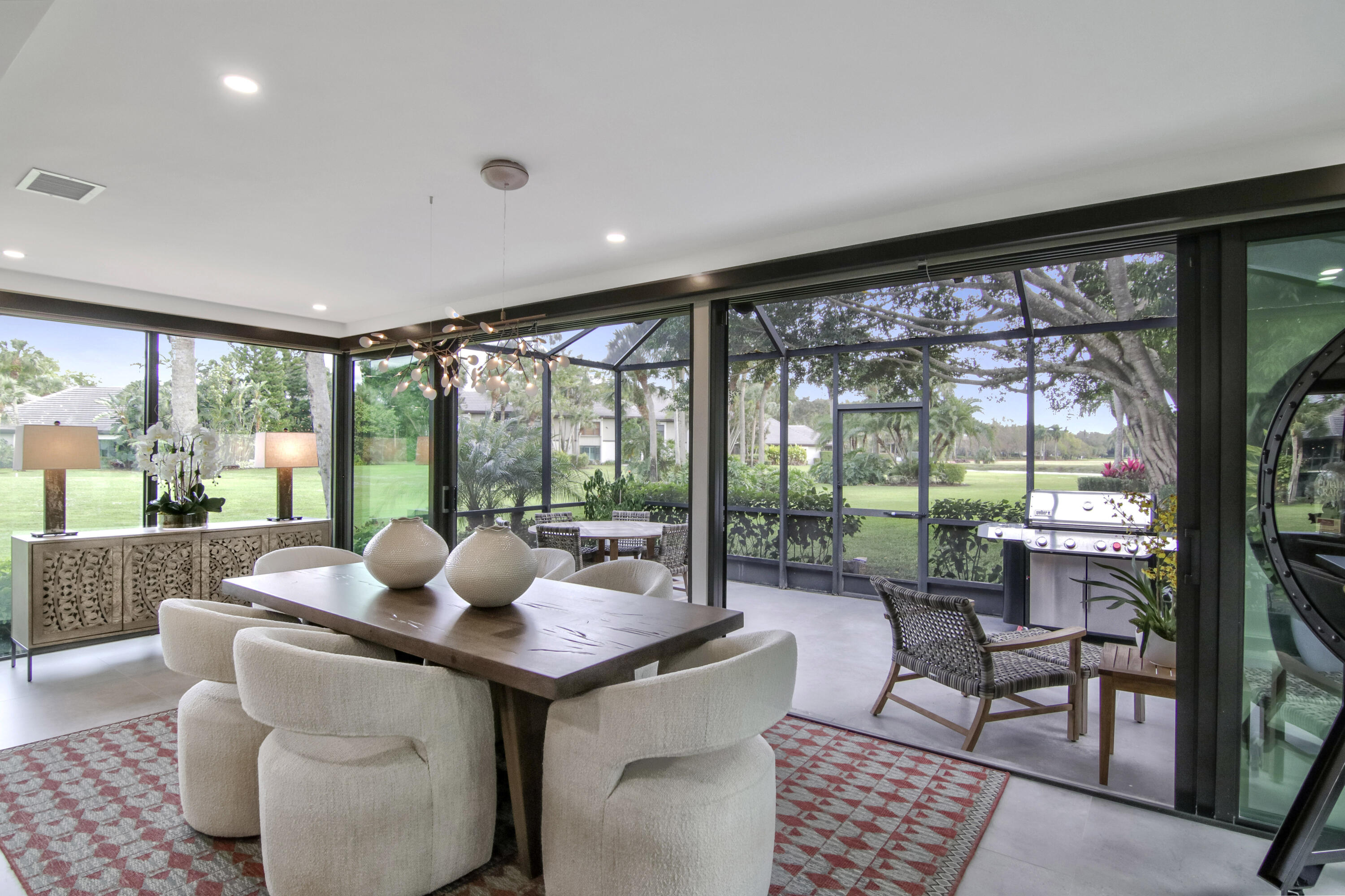13244 Polo Club Road, Unit C105 Wellington, FL 33414 - Photo 14 of 42 a dining room with furniture and large windows