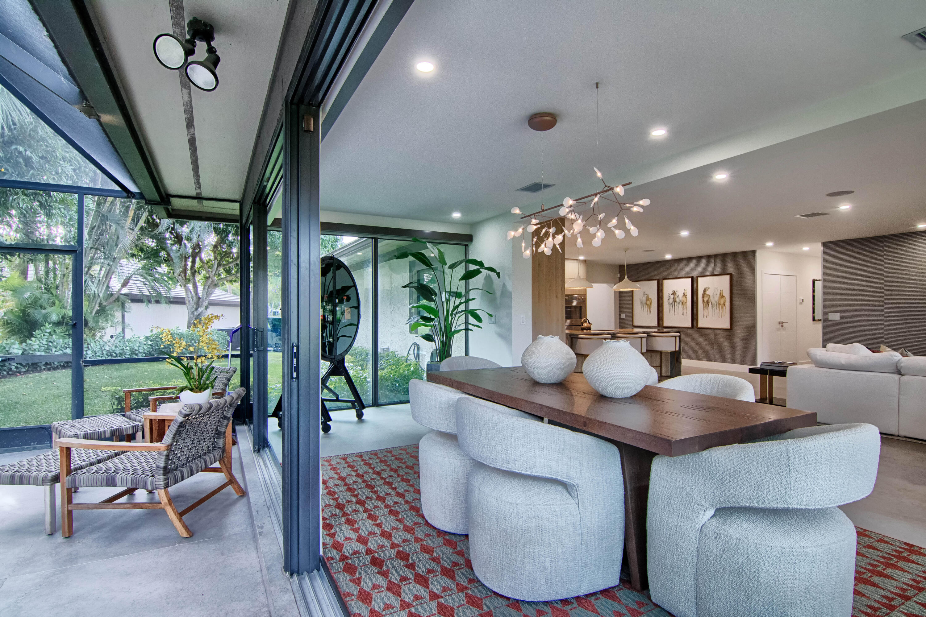 13244 Polo Club Road, Unit C105 Wellington, FL 33414 - Photo 15 of 42 a dining room with furniture and a floor to ceiling window