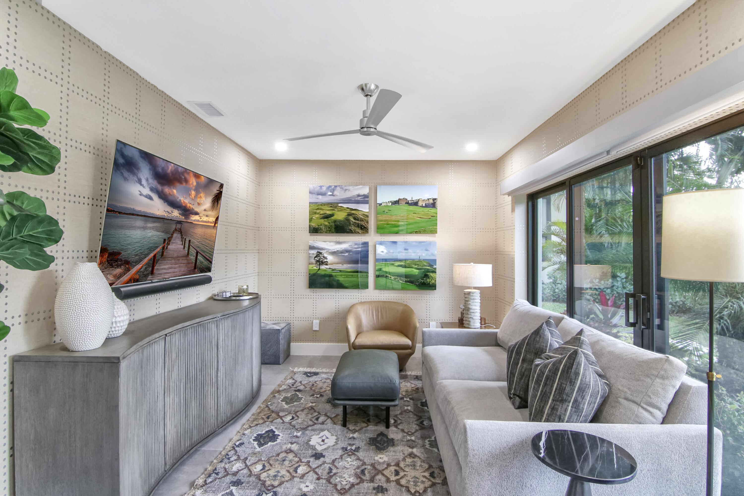 13244 Polo Club Road, Unit C105 Wellington, FL 33414 - Photo 18 of 42 a living room with furniture a large window and a flat screen tv