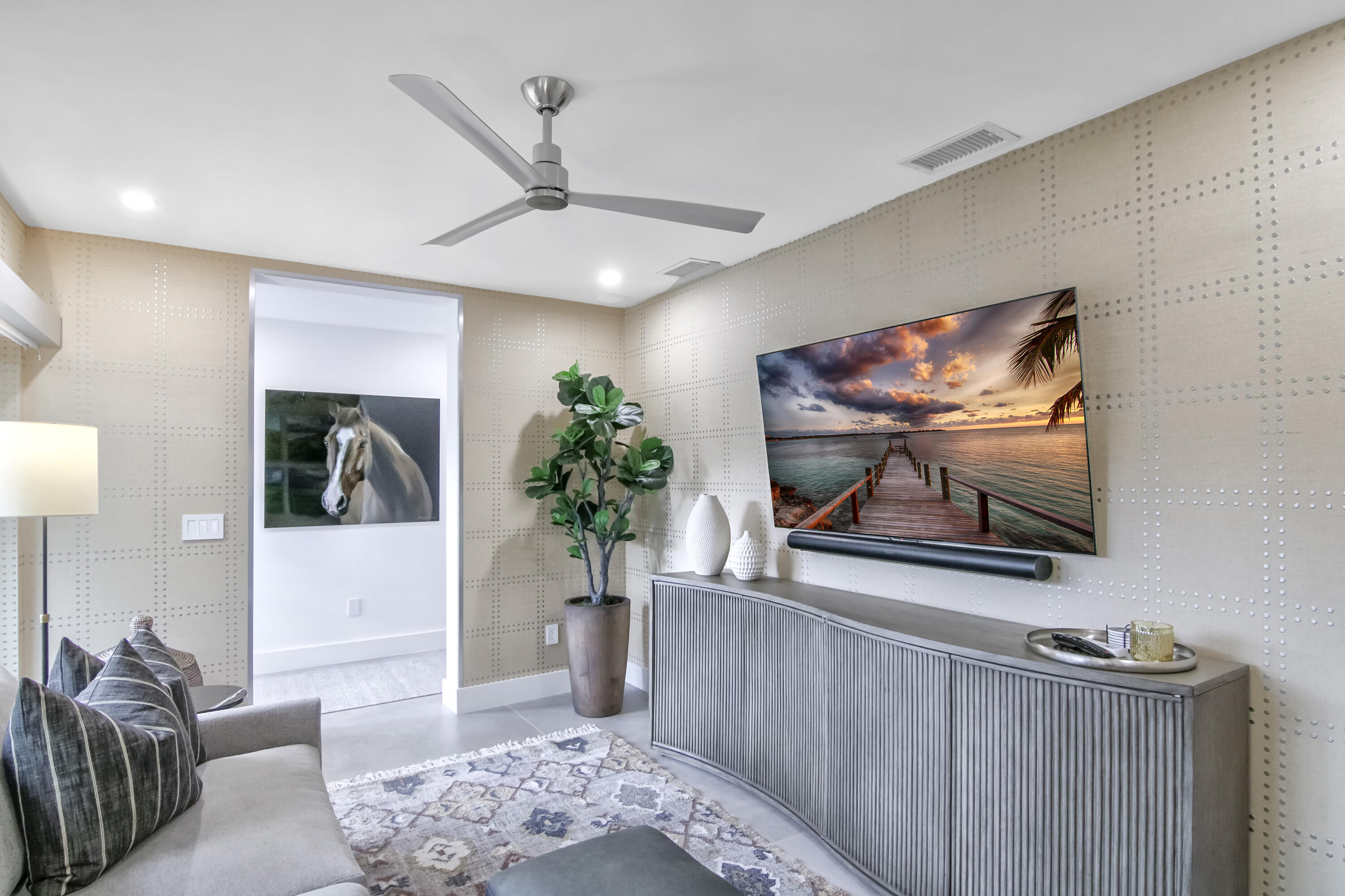 13244 Polo Club Road, Unit C105 Wellington, FL 33414 - Photo 19 of 42 a living room with furniture and a flat screen tv