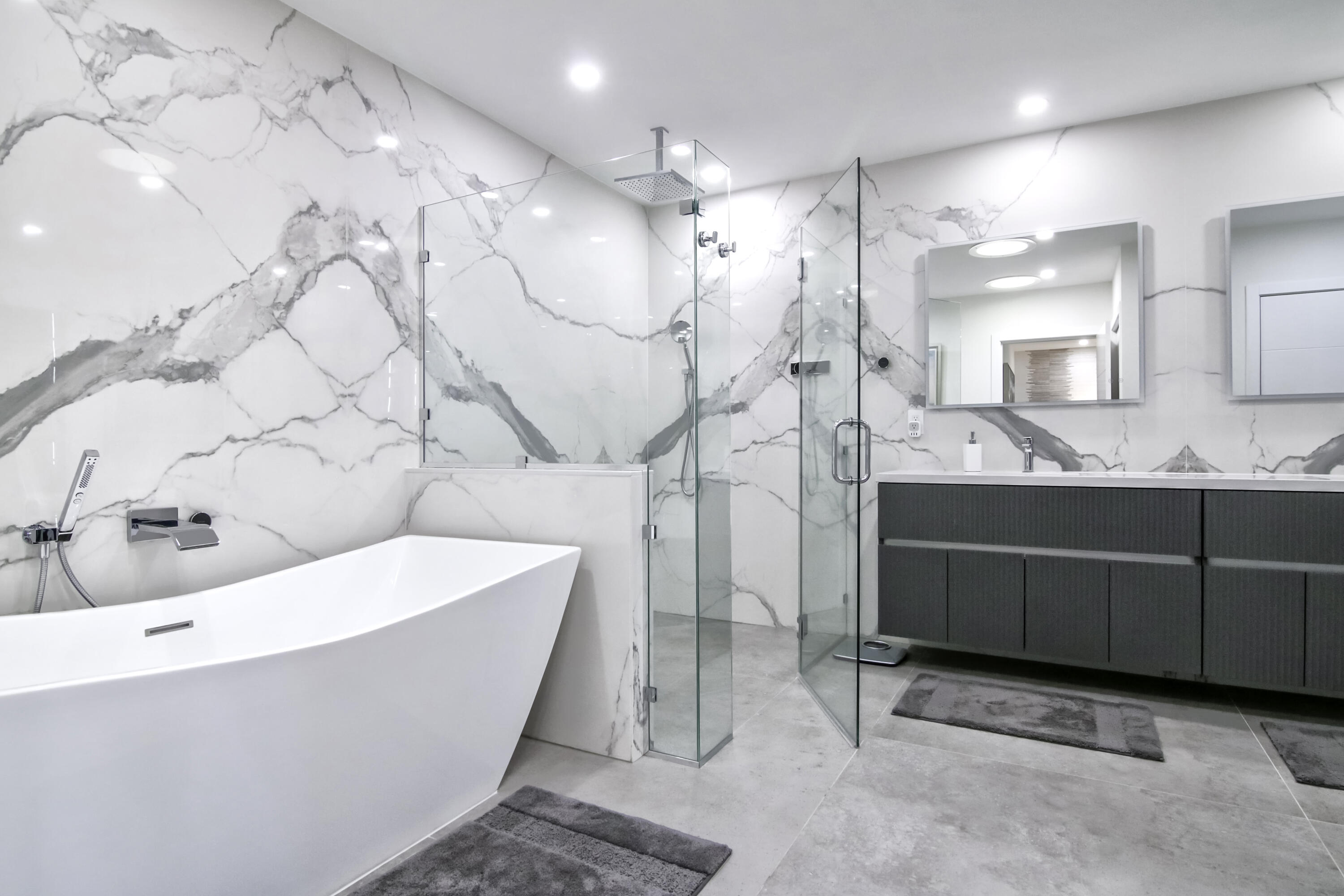 13244 Polo Club Road, Unit C105 Wellington, FL 33414 - Photo 23 of 42 a bathroom with a bathtub and a double vanity sink