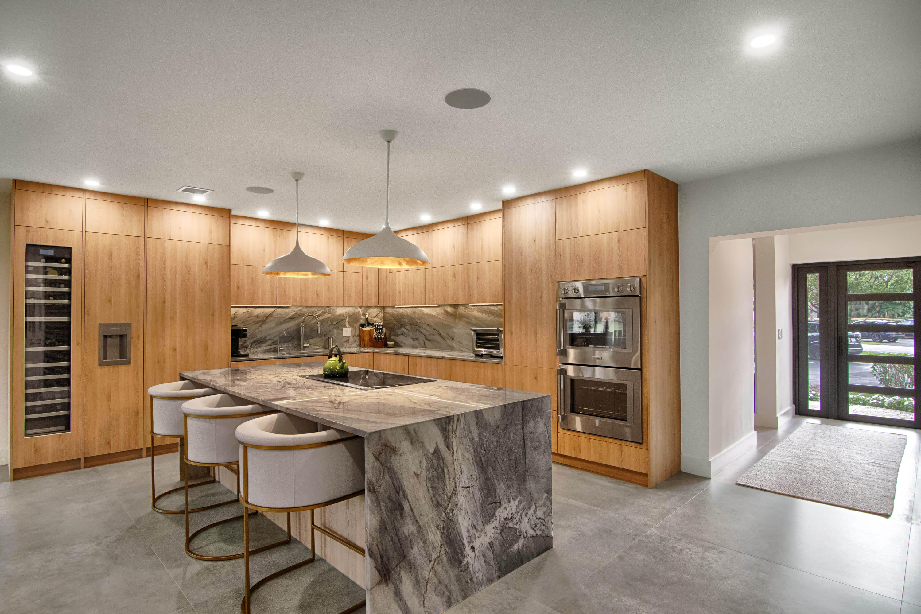 13244 Polo Club Road, Unit C105 Wellington, FL 33414 - Photo 4 of 42 a kitchen with stainless steel appliances granite countertop a sink a stove and a refrigerator