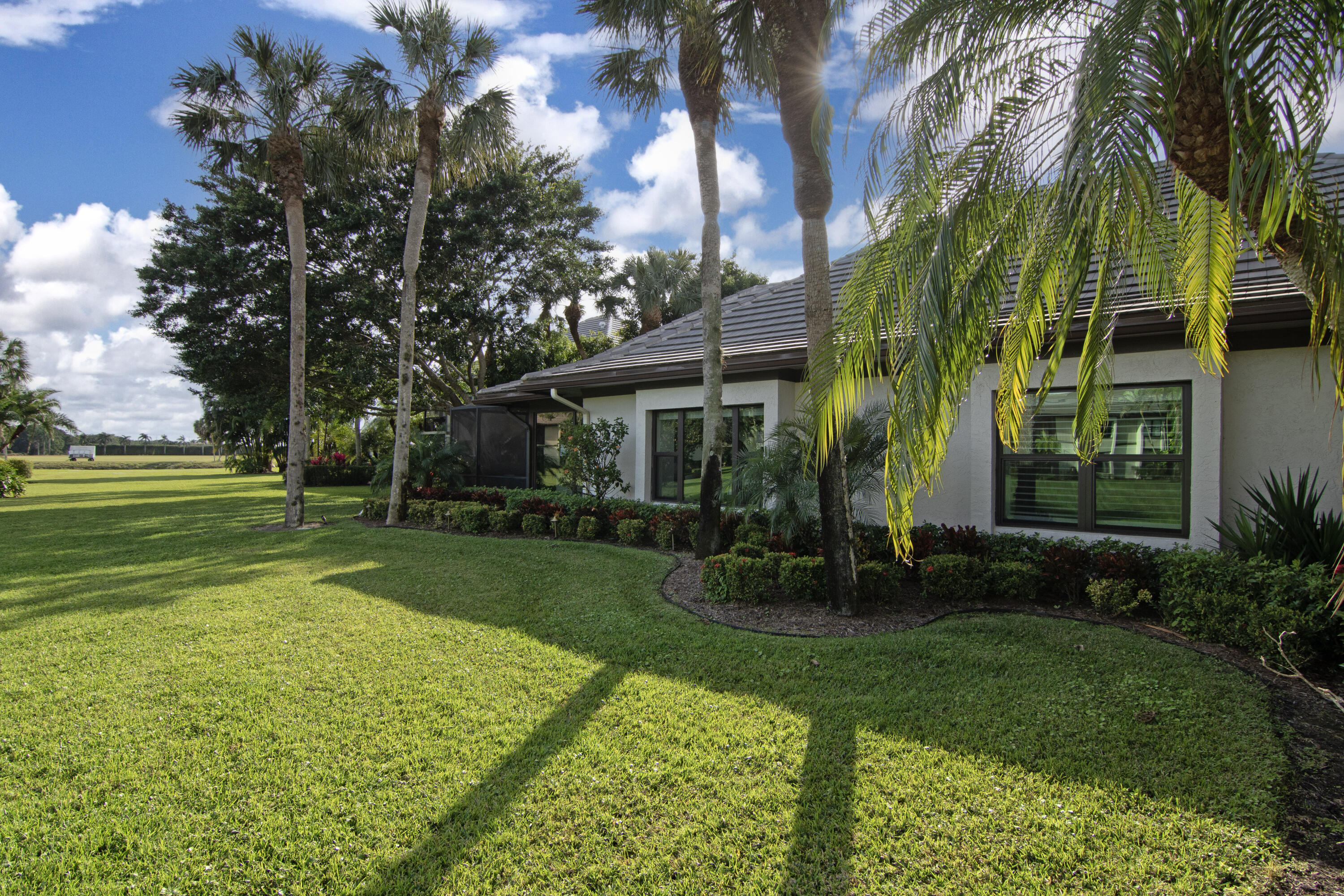 13244 Polo Club Road, Unit C105 Wellington, FL 33414 - Photo 42 of 42 a view of a house with a yard