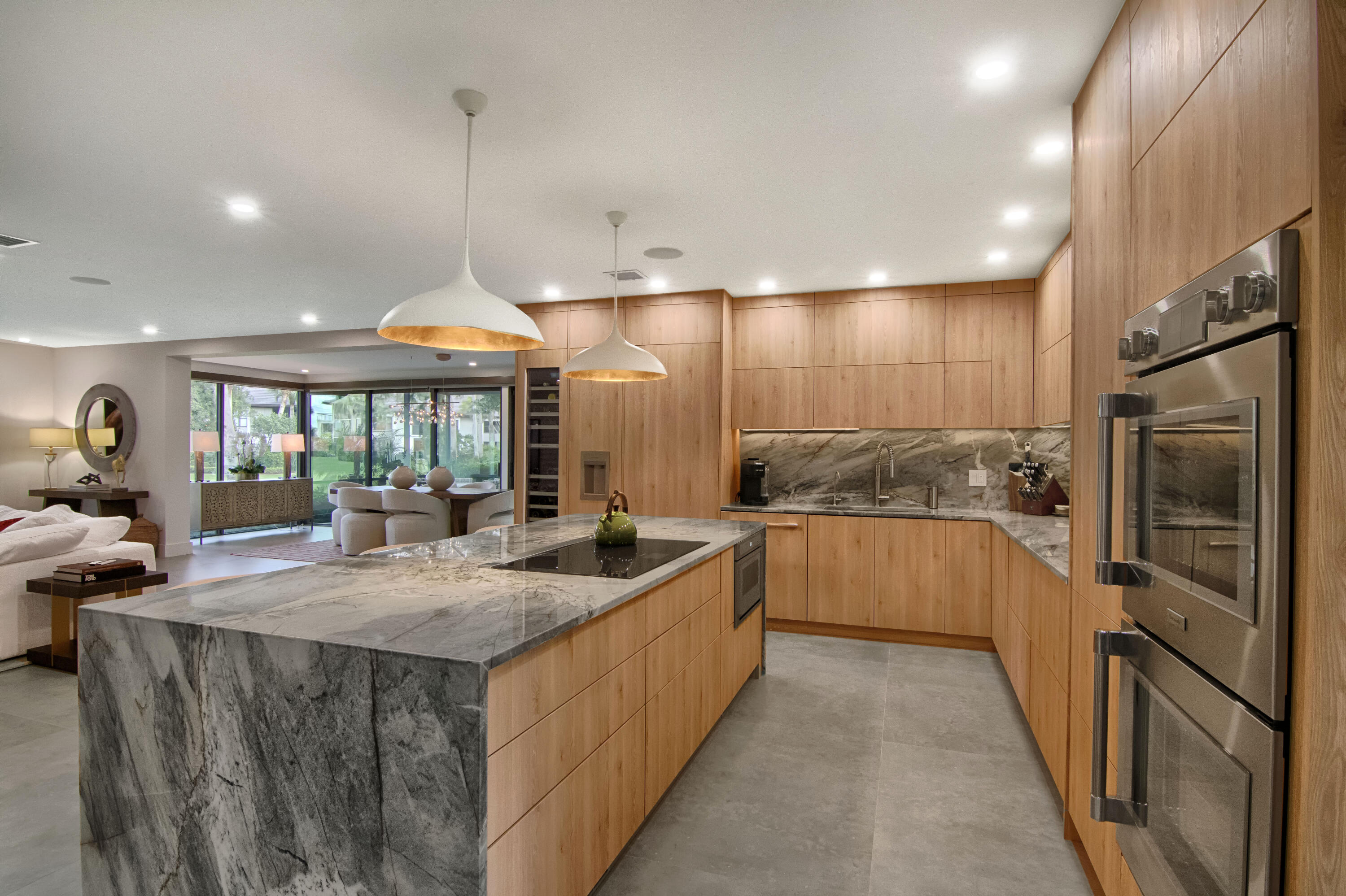 13244 Polo Club Road, Unit C105 Wellington, FL 33414 - Photo 5 of 42 a kitchen with stainless steel appliances granite countertop a sink and a refrigerator