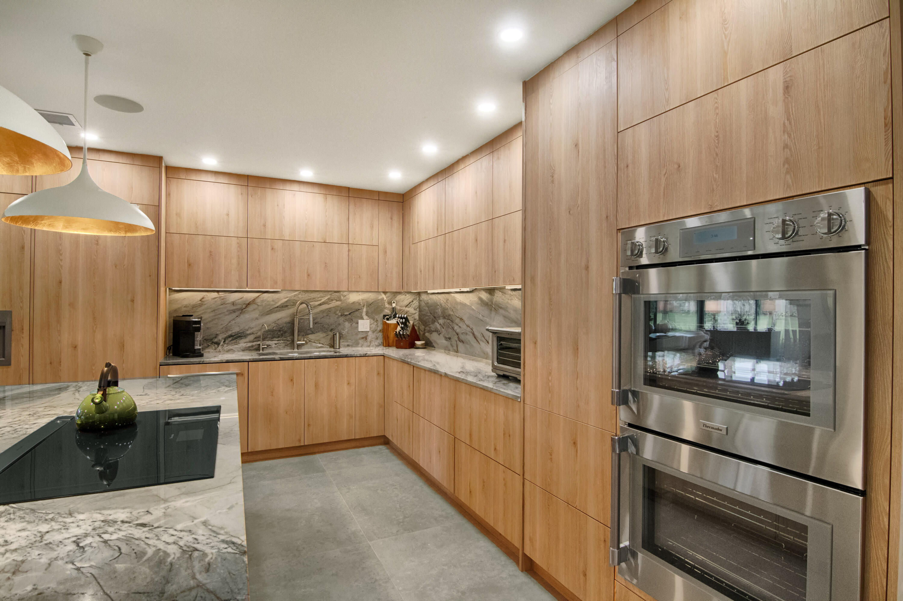 13244 Polo Club Road, Unit C105 Wellington, FL 33414 - Photo 6 of 42 a kitchen with stainless steel appliances granite countertop a refrigerator and a sink