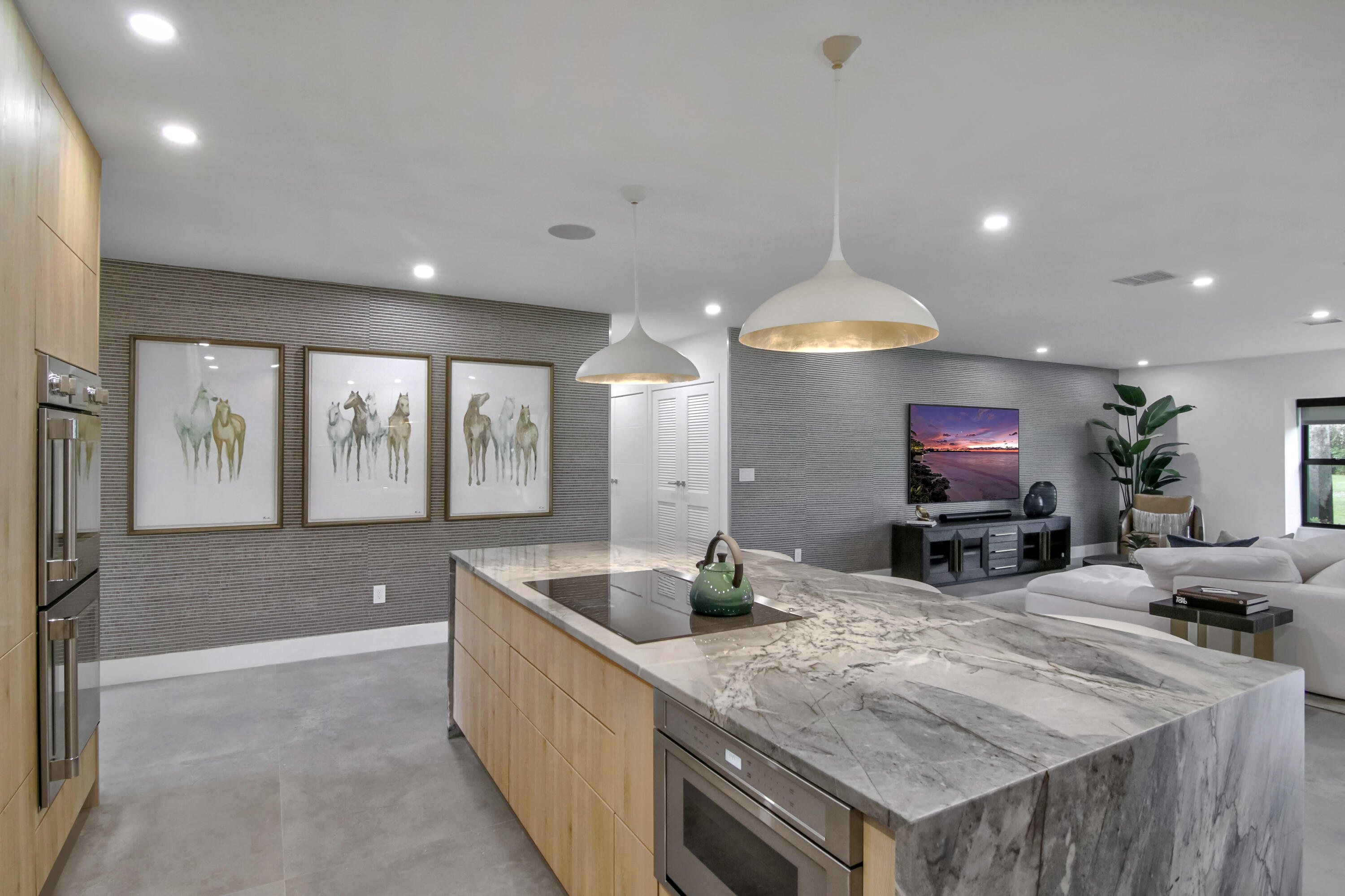 13244 Polo Club Road, Unit C105 Wellington, FL 33414 - Photo 7 of 42 a large kitchen with stainless steel appliances a large counter top
