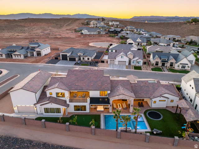 4871 South Homestead Way Washington, UT 84780 - Photo 136 of 151 Aerial view at dusk of view of pool area, a residential view, and a mountain view