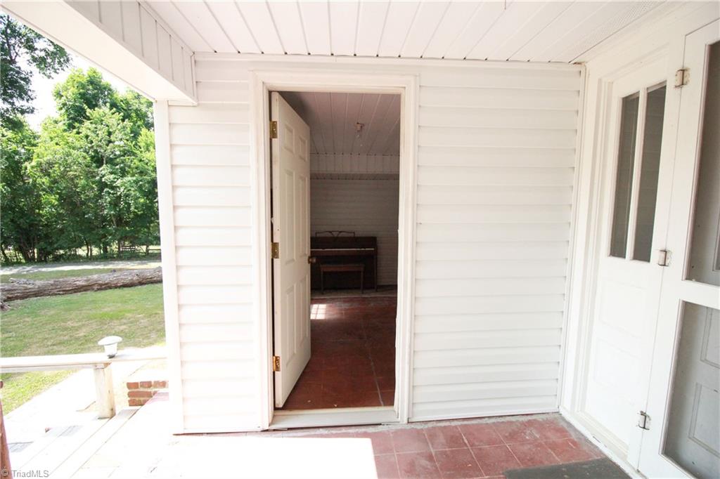 2067 Riverside Circle Eden, NC 27288 - Photo 12 of 50 Covered porch with door open to enclosed porch