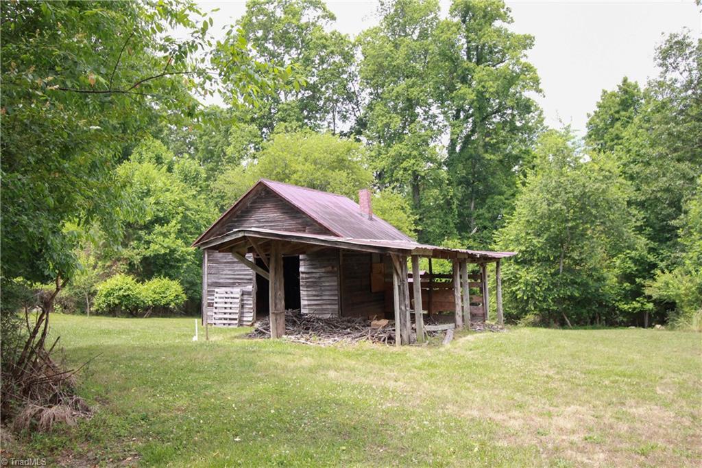 2067 Riverside Circle Eden, NC 27288 - Photo 18 of 50 Wood siding with lein-to shed area