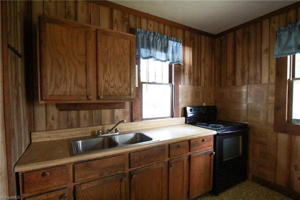 2067 Riverside Circle Eden, NC 27288 - Photo 39 of 50 Kitchen with wood cabinets, slide-in range