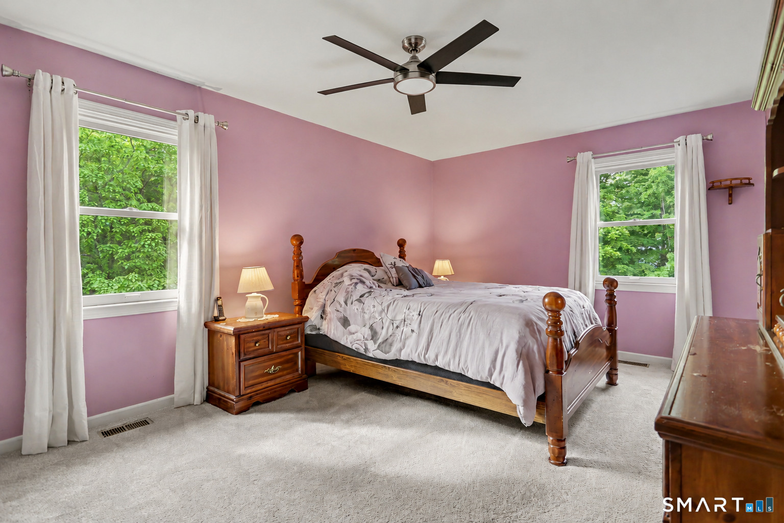 632 Wheelers Farm Road Orange, CT 06477 - Photo 16 of 39 a bedroom with a bed and a large window