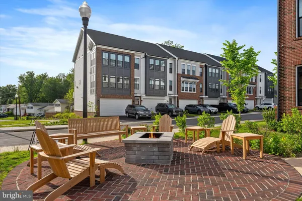 a view of a house with pool porch and chairs