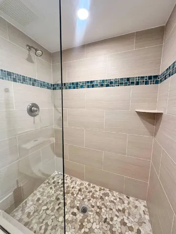 a bedroom with a bed and a lamp