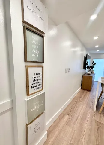 a view of a lake with a lawn chairs