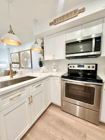 a kitchen with a stove and a microwave