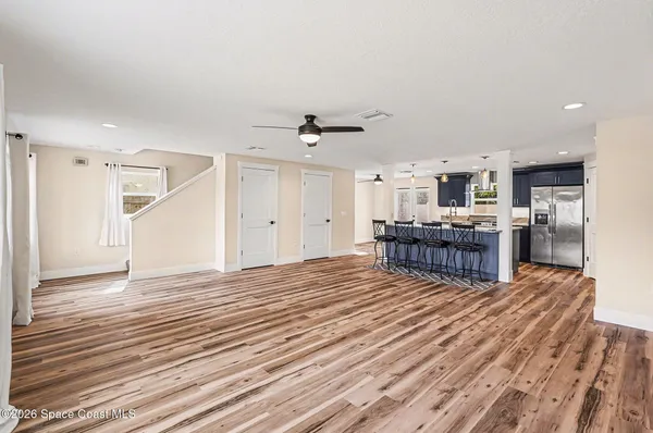 a view of kitchen with furniture and wooden floor