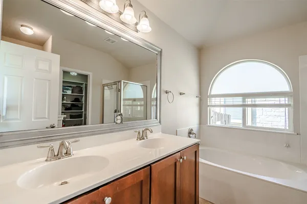 a bench sitting in a room next to a window