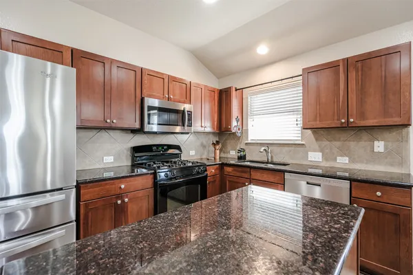 a view of a dining room with furniture