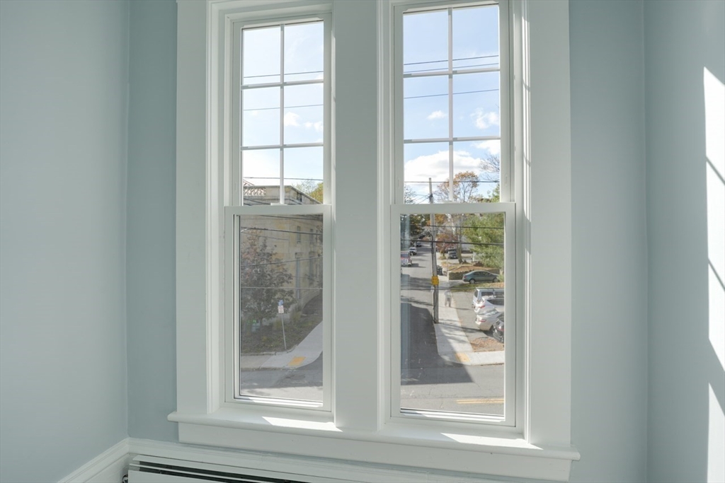 47 Mechanic Street, Unit 2 Marlborough, MA 01752 - Photo 14 of 26 a view of a glass door with a window