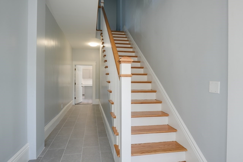 47 Mechanic Street, Unit 2 Marlborough, MA 01752 - Photo 19 of 26 a view of entryway and hall with wooden floor
