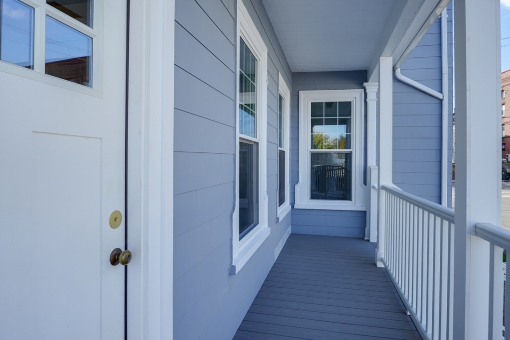47 Mechanic Street, Unit 2 Marlborough, MA 01752 - Photo 25 of 26 a view of a hallway with wooden floor and entryway
