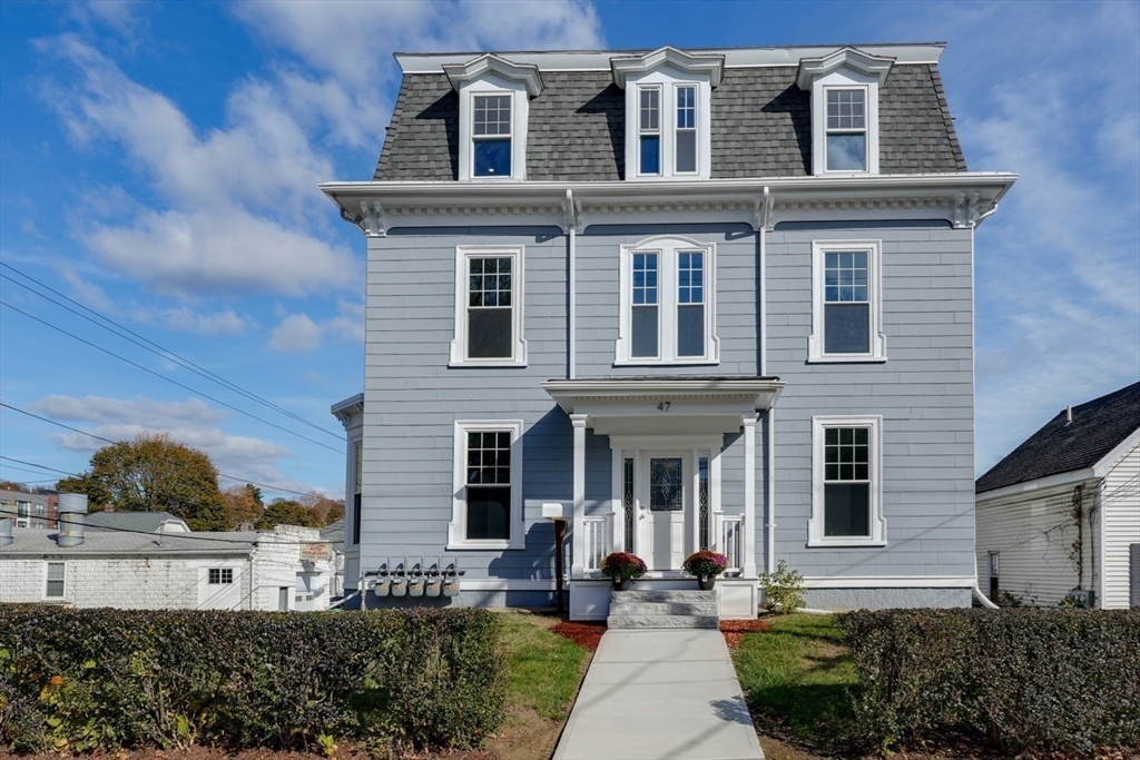 47 Mechanic Street, Unit 2 Marlborough, MA 01752 - Photo 26 of 26 a front view of a house with a yard