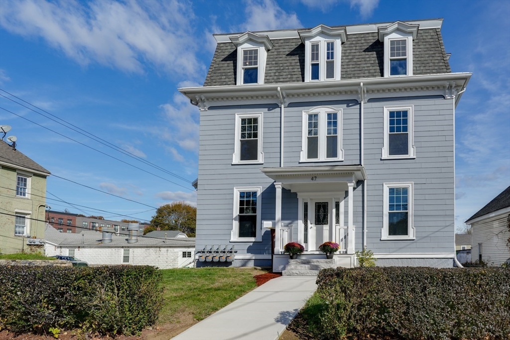 47 Mechanic Street, Unit 2 Marlborough, MA 01752 - Photo 5 of 26 a front view of a house with a garden