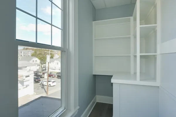 a view of a glass door with wooden floor